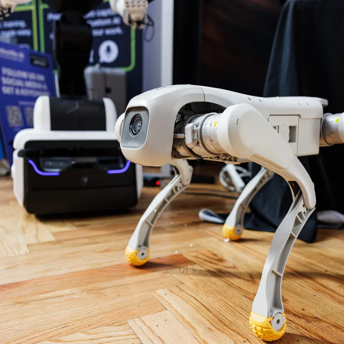 A four-legged robot standing on the exhibition floor